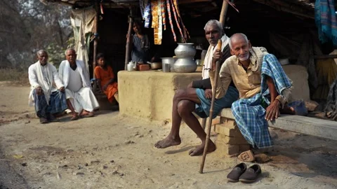 View of elderly men sitting outside a roadside stall, India. Video stock 335482675