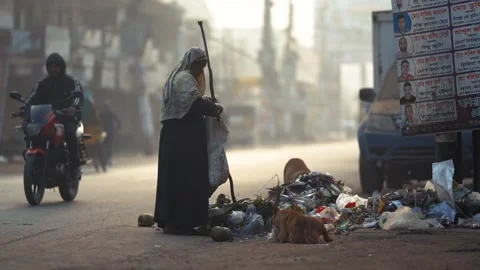 View of an elderly person scavenging trash in Bogura, Bangladesh. Stock Footage 335653594