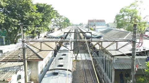 View of an electric train station in Jakarta, Indonesia. trains come and go. Stock Footage 248352277