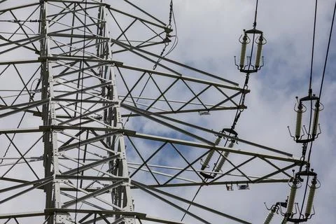 View of electrical insulators on a high-voltage overhead line pole. Foto stock