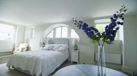 View of elegant bedroom in a stylish, classical home with a contemporary feel Stock Footage
