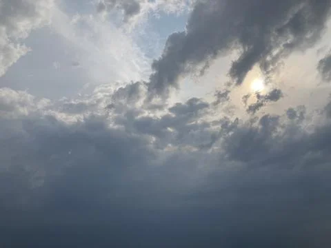 View from an elevated perspective of a cloudy, stormy sky with sunlight bre.. Stock Photos