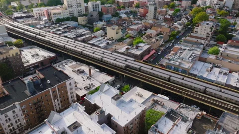 View of elevated subway train line in residential neighborhood ProRes 422HQ Stock Footage 317514371