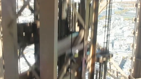 View from the elevator of the Eiffel tower, descent down. Stock Footage 125170909