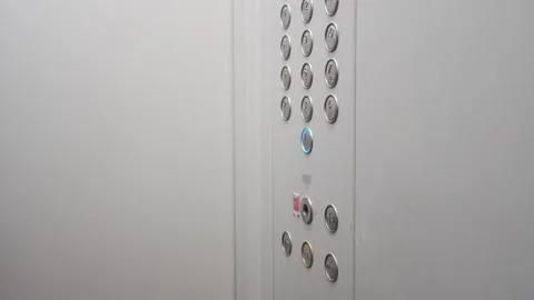 View of the elevator from the inside. The guy presses the elevator button Stock Footage 294018929