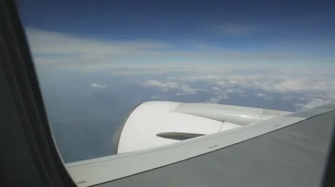View elyuminatory flying a passenger plane over the mountains in the clouds Video stock 63465159