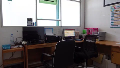 View of the empty administration room, there is a desk and office equipment.. Stock Footage 277438032