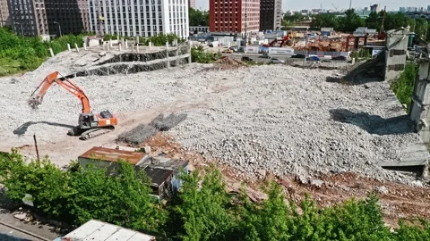 View of empty area after demolishing of old building with excavator on it Stock Footage 155048898