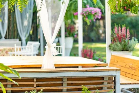 The view of empty chair and table in the fabulous garden decorated with han.. Foto stock