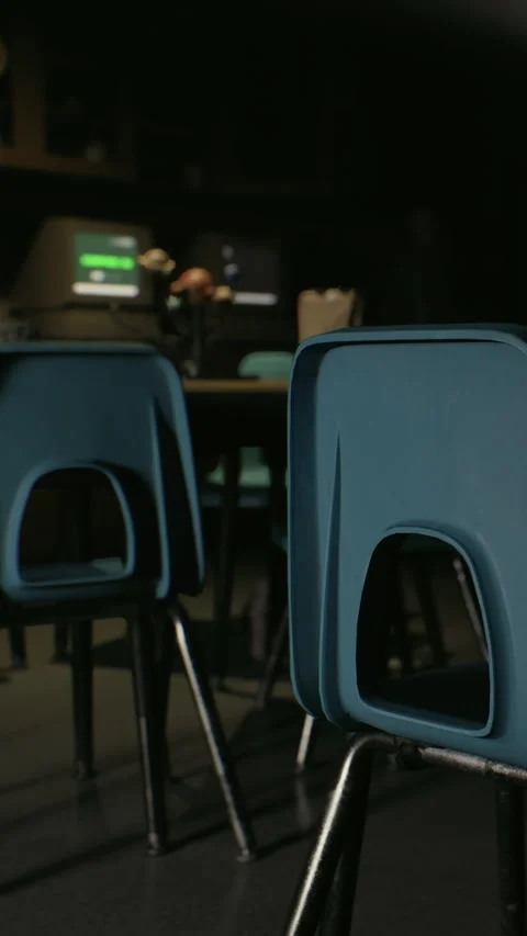 View of empty chairs in classroom during evening study session Stock Footage 341244612
