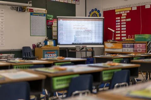 View of empty elementary school classroom in the US. Stock Photos