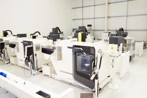 View Of Empty Engineering Workshop With CNC Machines Stock Photos
