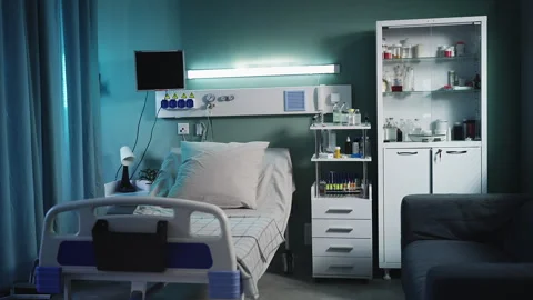 View of an empty ICU bed in hospital room with modern healthcare equipment Stock Footage 319736989