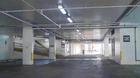 View of an empty indoor parking garage in 4k slow motion 60fps Stock Footage 288564583