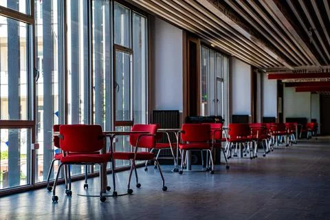 View of empty modern study area with red chairs 스톡 사진