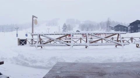 View of a empty outdoor cafe in snowfall during covid-19 Stock Footage 146666398
