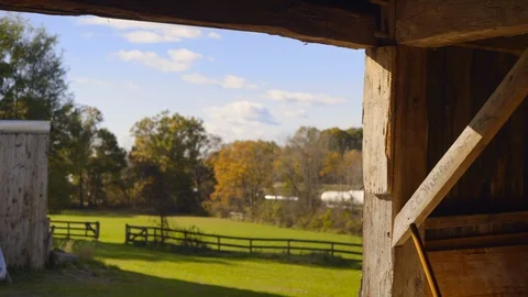 View of an Empty Paddock Seen From the Inside Interior of a Barn Video stock 103993642