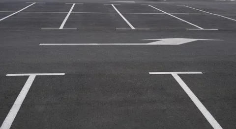 View on empty parking with clear markings and arrows indicating the direction Stock Photos