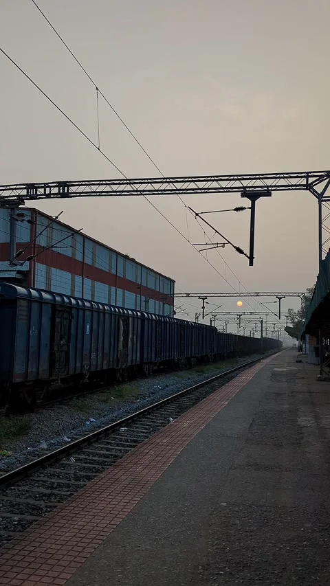 View of empty railway station with goods service train standing during peac.. Stock Footage 339080888