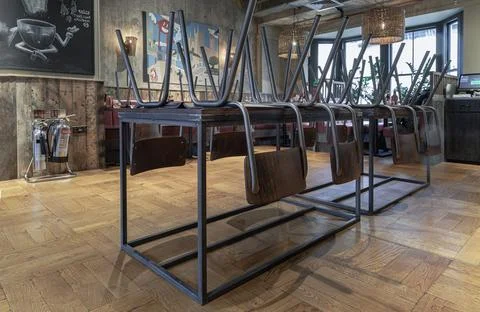 View of an empty restaurant with Set Wooden dining tables and chairs and Re.. Stock Photos