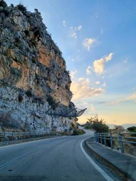 View of an empty road between mountains leading to the Greece Stock Photos