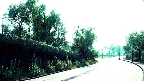 View of empty road with lamp post and sunlight Photos