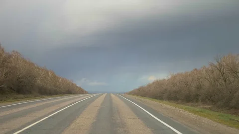 View of empty road out of the windshield of the car window. copy space Stock Footage 129319228