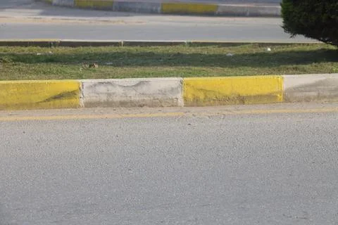 View of the empty road scene, highway in the city, trees and bushes, curb s.. Stock Photos
