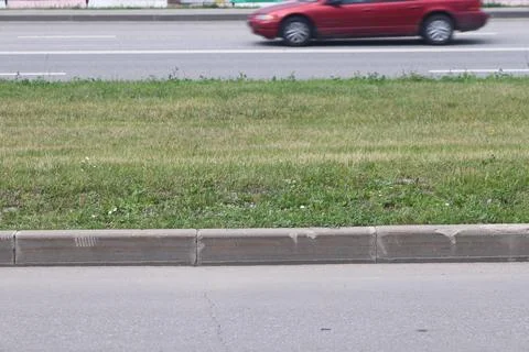 View of the empty road scene, highway in the city, trees and bushes, curb s.. Stock Photos