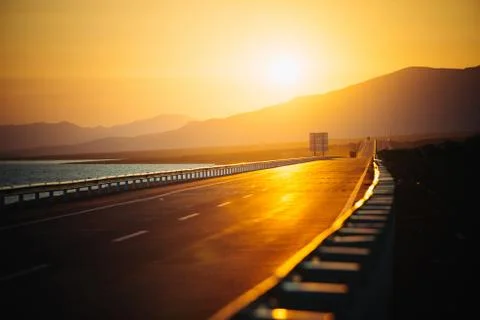 View of empty road at sunset Stock Photos
