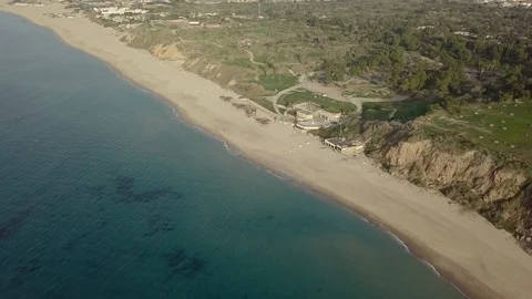 View of empty off-season beach coastline with park infarastructure Stock Footage 100633420