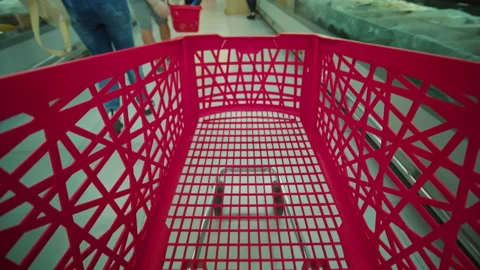 View of the empty shopping red trolley cart without food. Timelapse of shopping Stock Footage 215014226