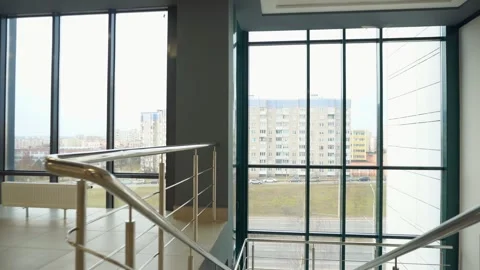 View of an empty spacious hall with columns and panoramic windows. Stock Footage 287095077