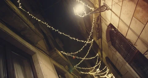 View of empty streets old quarter of Gothic with christmas lights decoration at 스톡 동영상 140972107