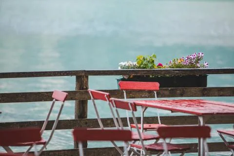 View of empty tables and chairs in outdoors cafe Stock Photos