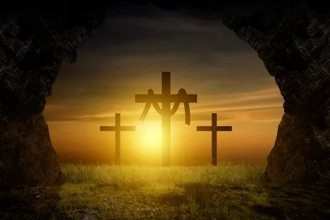 View from an empty tomb looking out at three crosses on a hill during a gol.. Foto stock