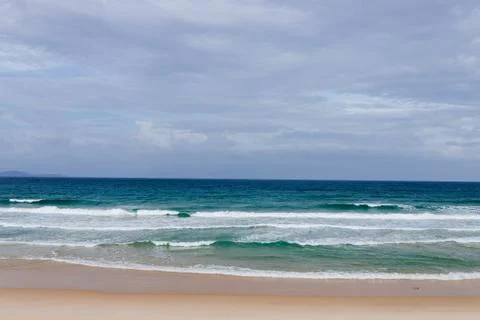 View of an empty tropical beach at sunset Stock Photos