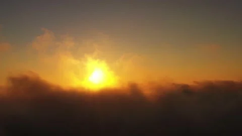 View on the endless cloudscape. Aerial view of morning sun in bright colors Stock Footage 143349534