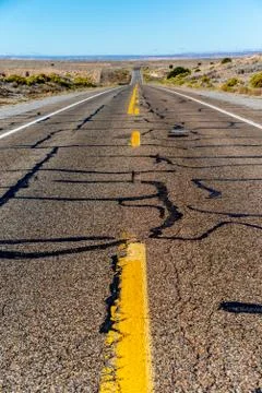 View of an endless straight road running through the desert Fotos de archivo