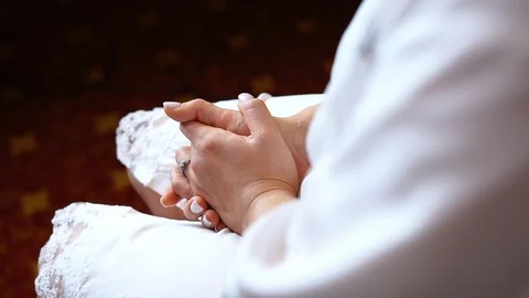 View of an engagement ring on a bride as she's getting makeup on her wedding day Video stock 89450262