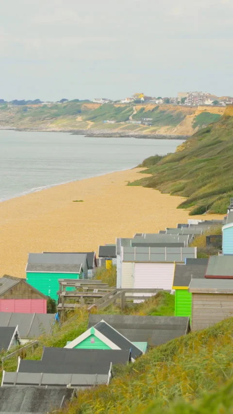 A view of the English coast featuring beach huts Stock Footage 280703173