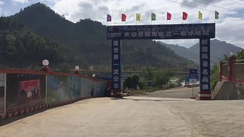 View of entrance gate to the construction of one of the Nam Ou River Cascade Stock Footage 77862969