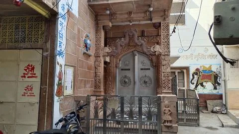 View of entry gate of a temple with beautiful carving in the streets of Jodhpur Stock Photos