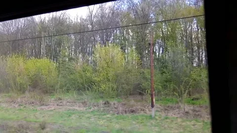 View of the environment and villages from a window of quickly going train Stock Footage 76265544