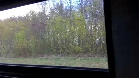 View of the environment and villages from a window of quickly going train Stock Footage 76268033