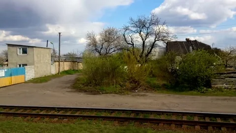 View of the environment and villages from a window of quickly going train Stock Footage 76268963