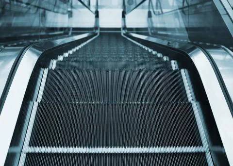 View of escalator inside office or business center Stock Photos
