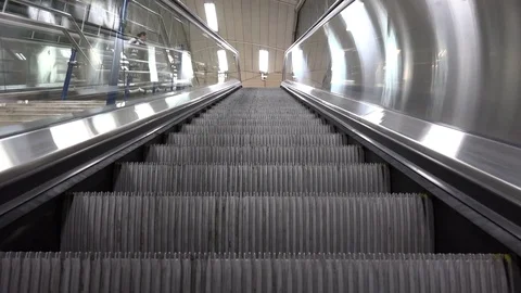 View of escalator motion up at subway indoor moving staircase of passage walkway Stock Footage 81979436