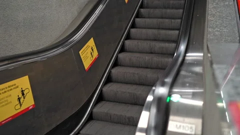 View on escalator moving up line and staircases in underground subway station Stock Footage 145736947