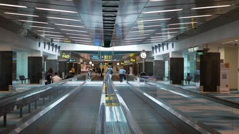 View on escalator walkway interior inside airport departure terminal with m.. Stock Footage 276352958